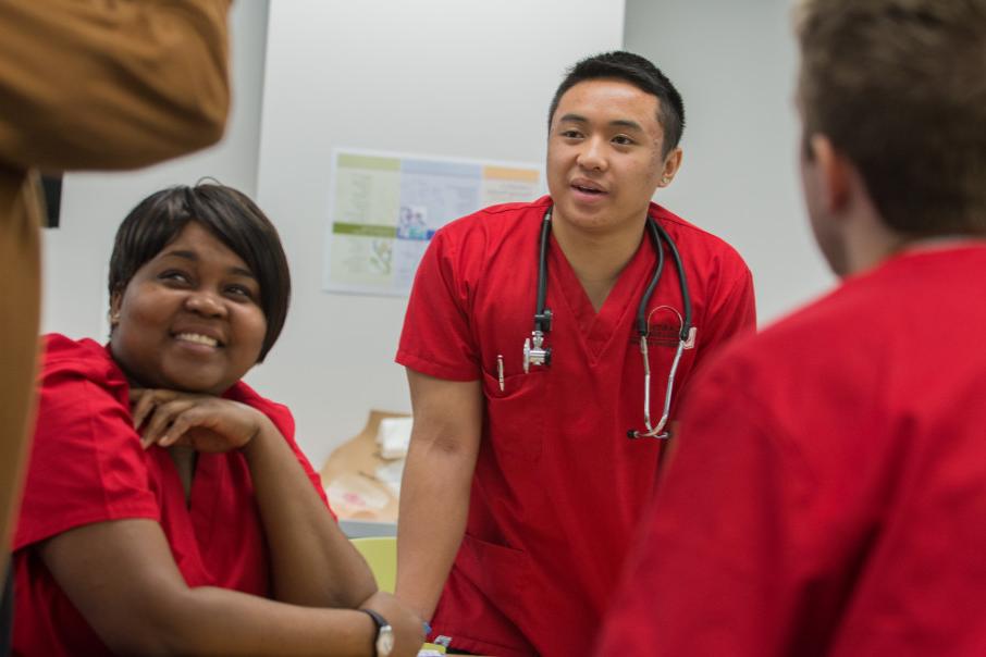 Nursing students participating in a clinical at an off-campus healthcare facility.